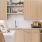 Beige Elm Cabinets with White Quartz Countertops and Herringbone Tile Backsplash