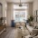Savannah, GA, Luxury Apartments with In-Unit Washer and Dryer - Aventon Victory - Living Room with a Large Window and View of the Pool, White Couch, and 9' Ceilings with a Ceiling Fan and Wood-Inspired Plank Flooring